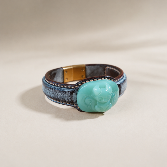 Russet and celadon fox jade leather bracelet with symbolic motif
