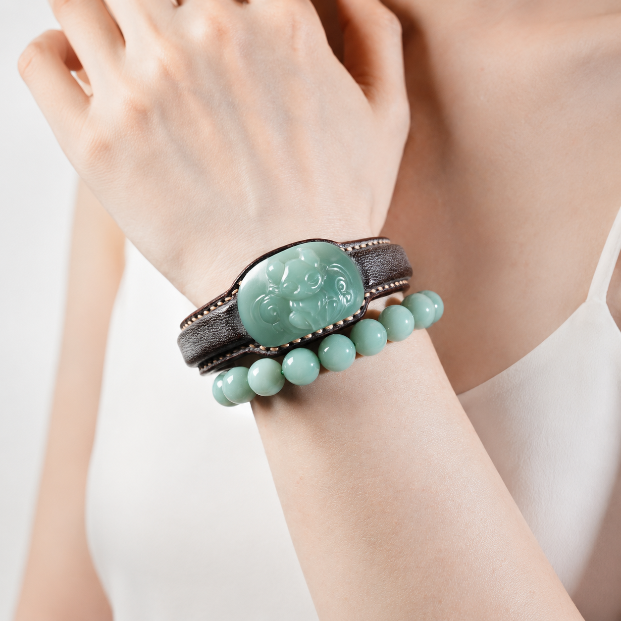 Russet and celadon fox jade leather bracelet with symbolic motif
