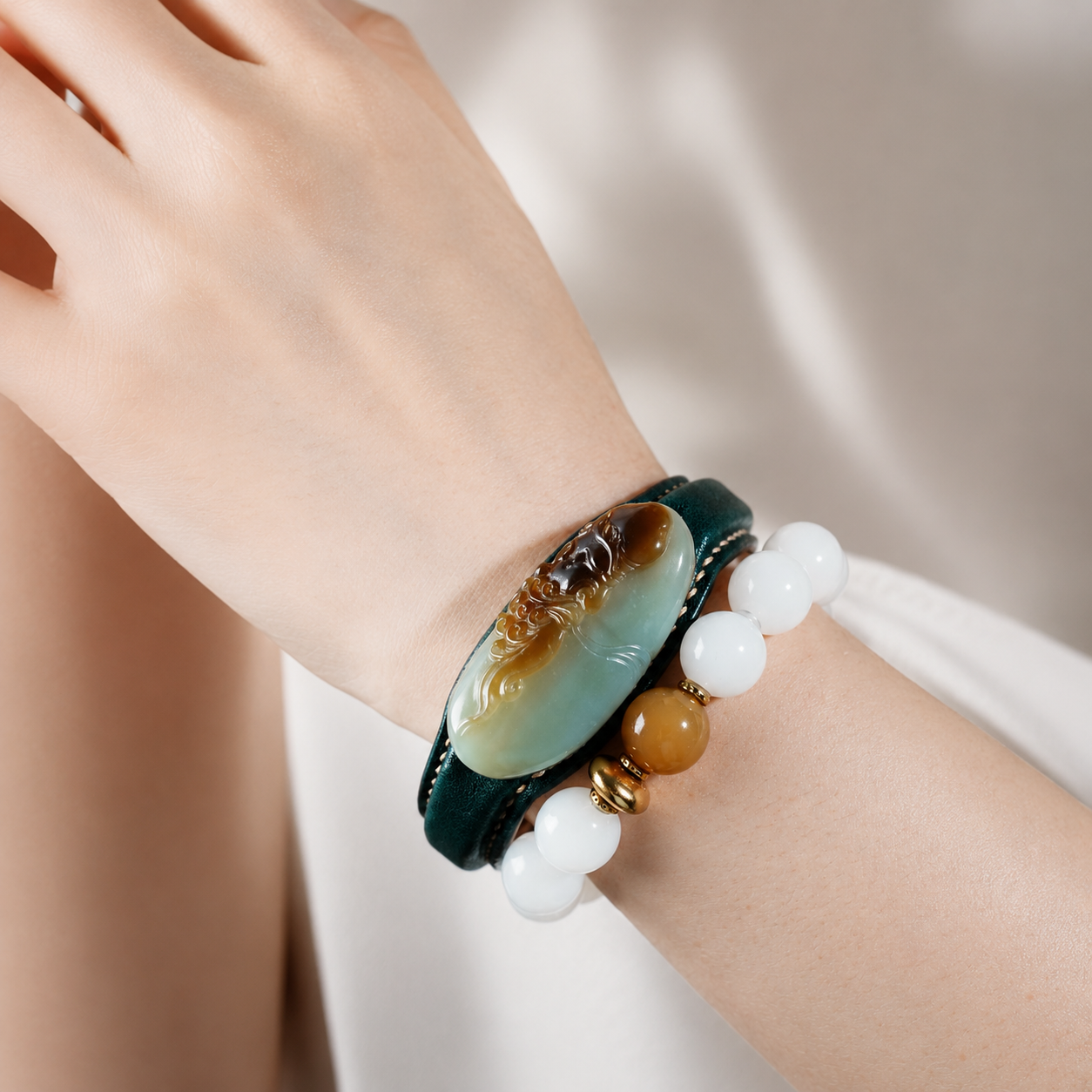 Green and white Daruma jade leather bracelet with carved jade accent