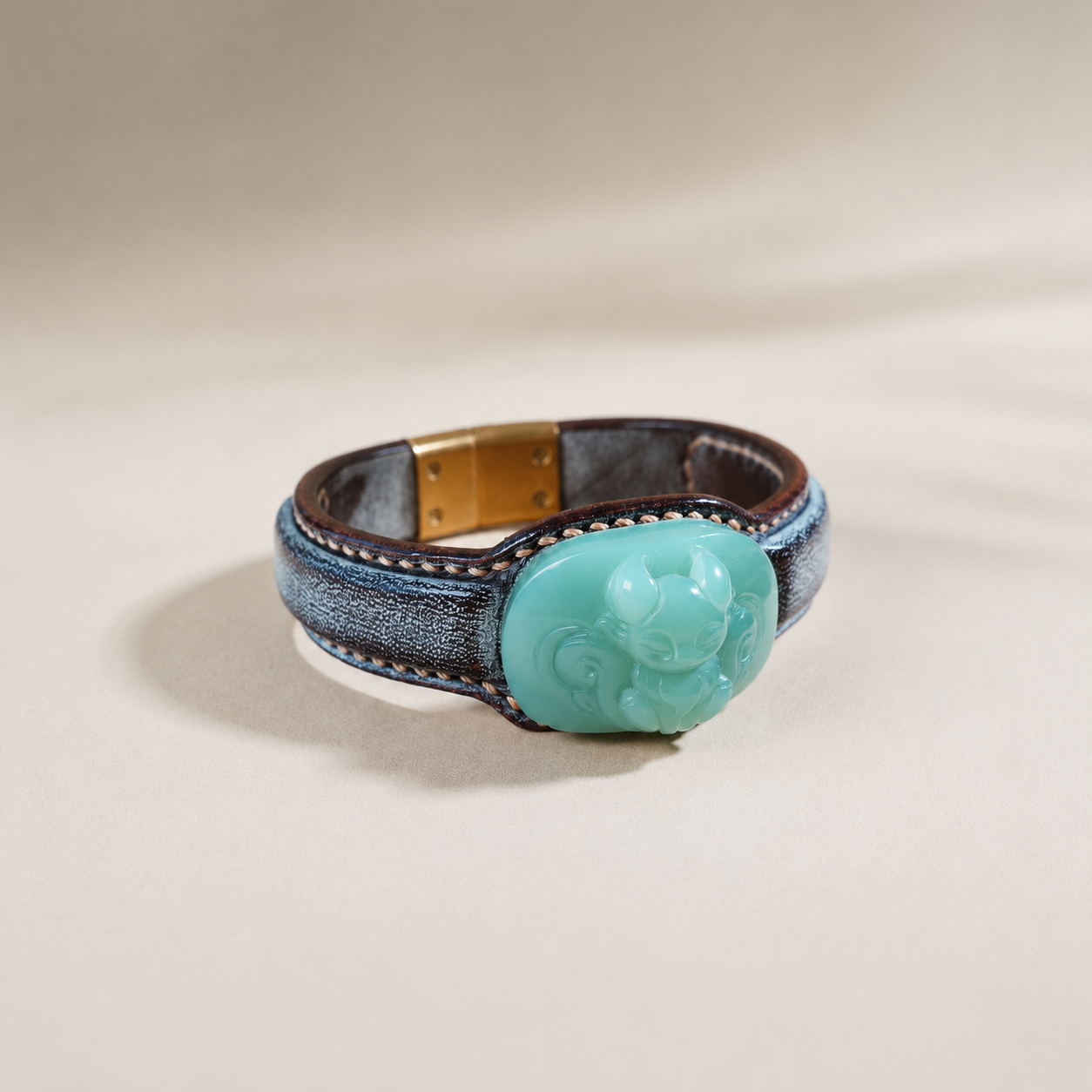 Russet and celadon fox jade leather bracelet with symbolic motif