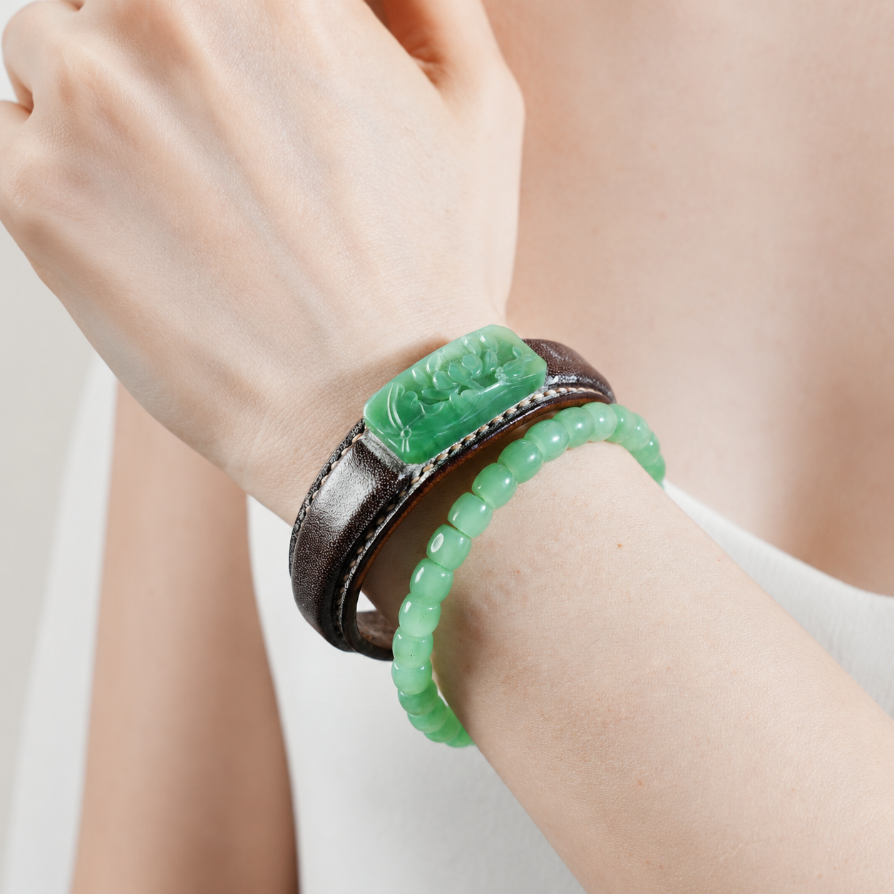 Russet and green lotus jade leather bracelet with symbolic jade detail