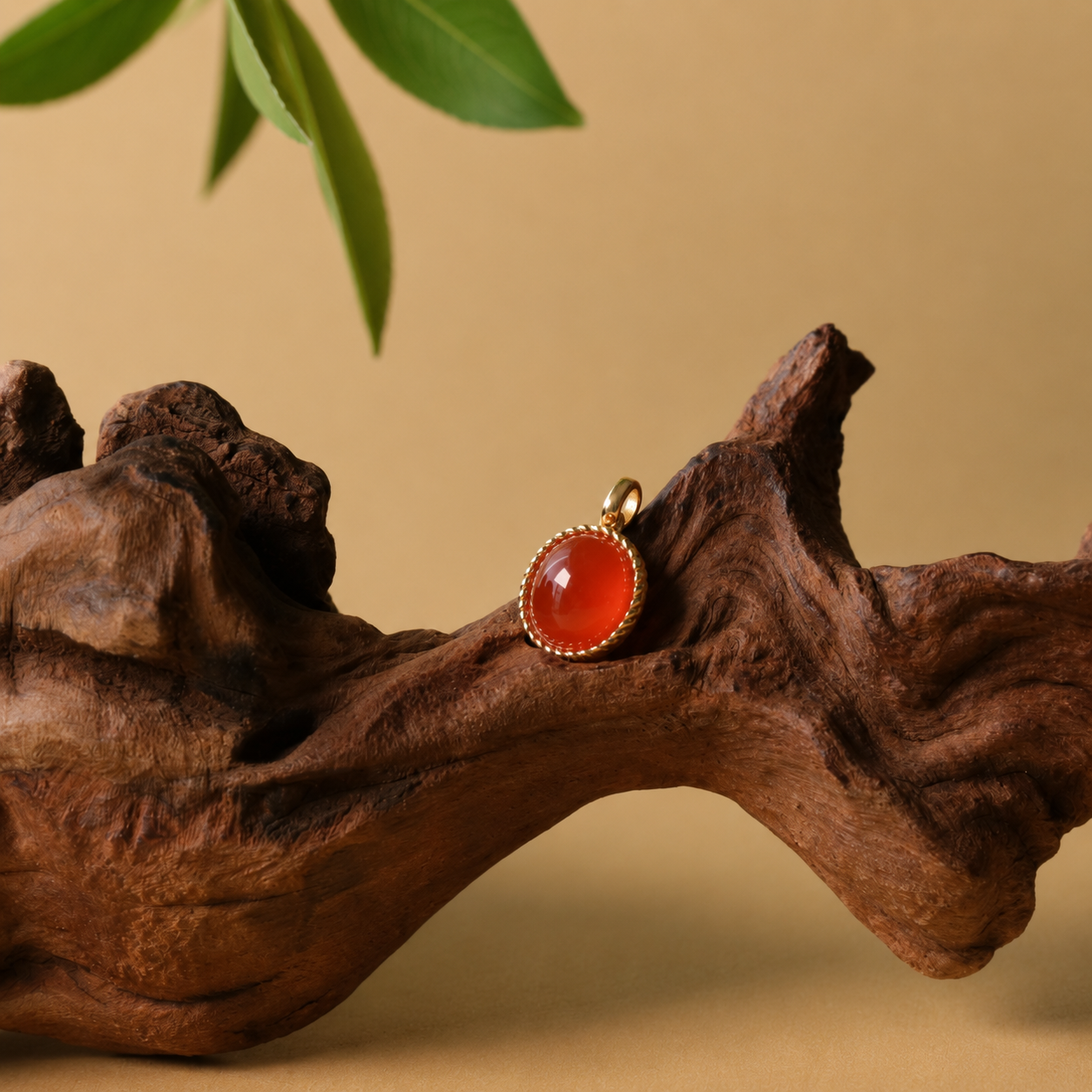 Twisted red agate pendant necklace in gold-tone setting