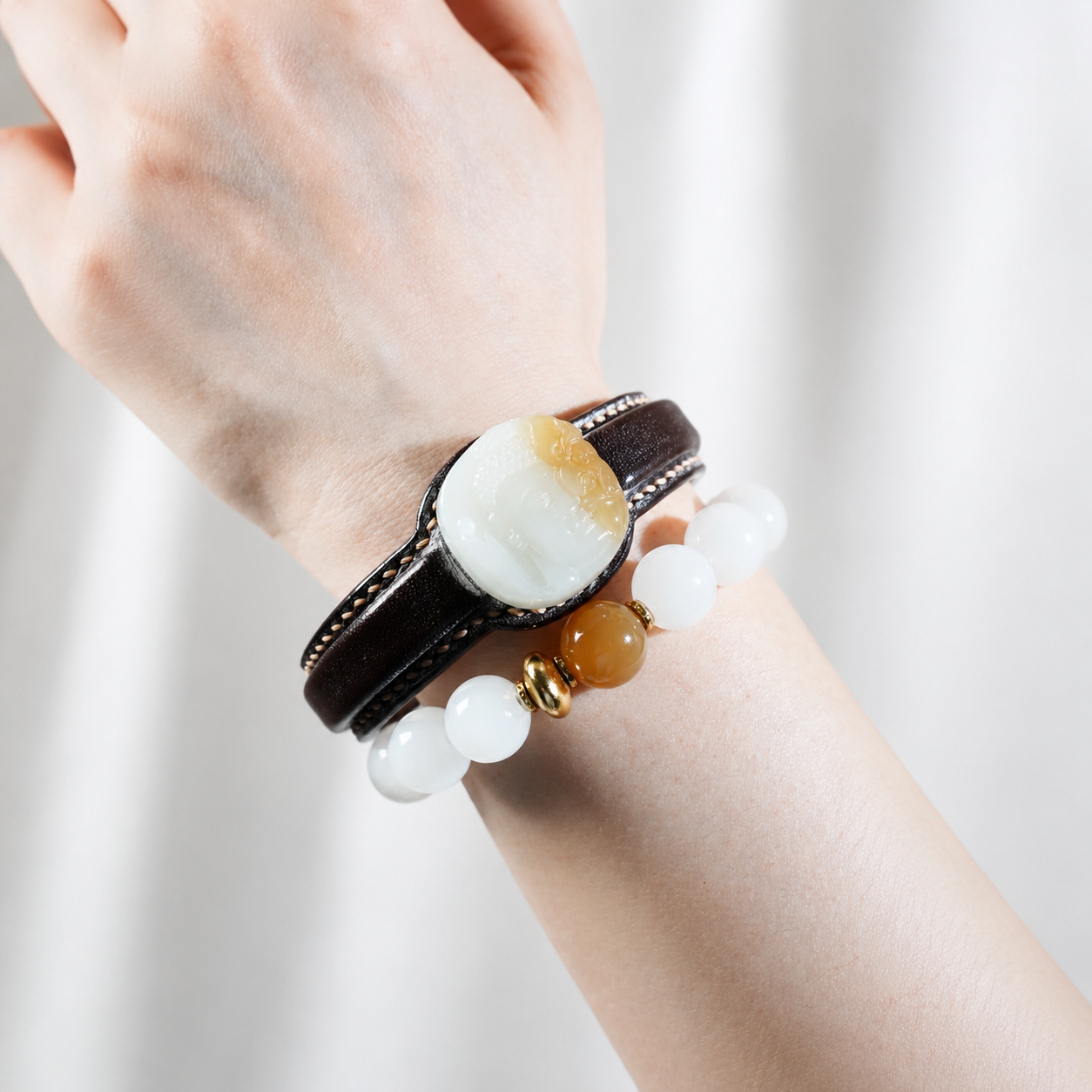 Russet and white Zen jade leather bracelet with carved jade centerpiece