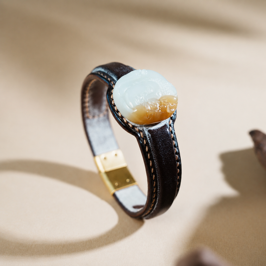 Sculptural sugar white jade leather bracelet with carved jade centerpiece